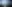 Offshore wind turbines in a reflective calm ocean with light mist