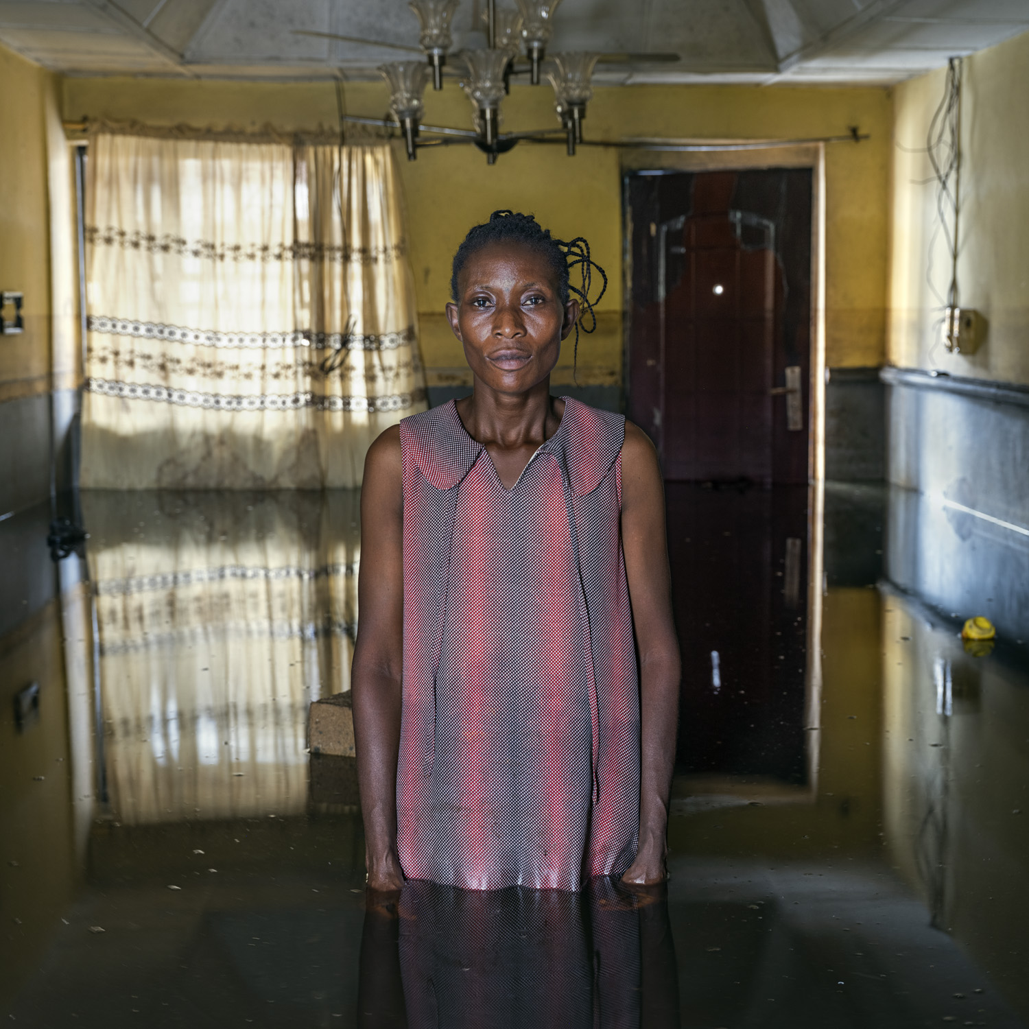 A woman in her flooded home.