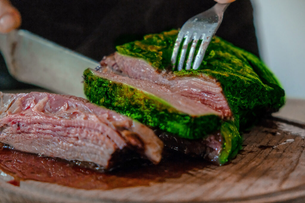 Photo illustration shows a sliced steak coloured green on the outside