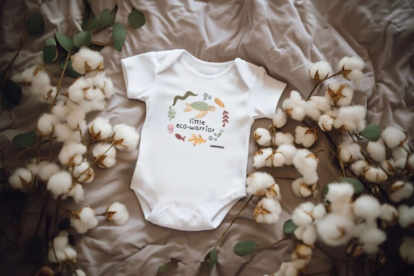 Little eco warrior baby grow with a turtle design on the front