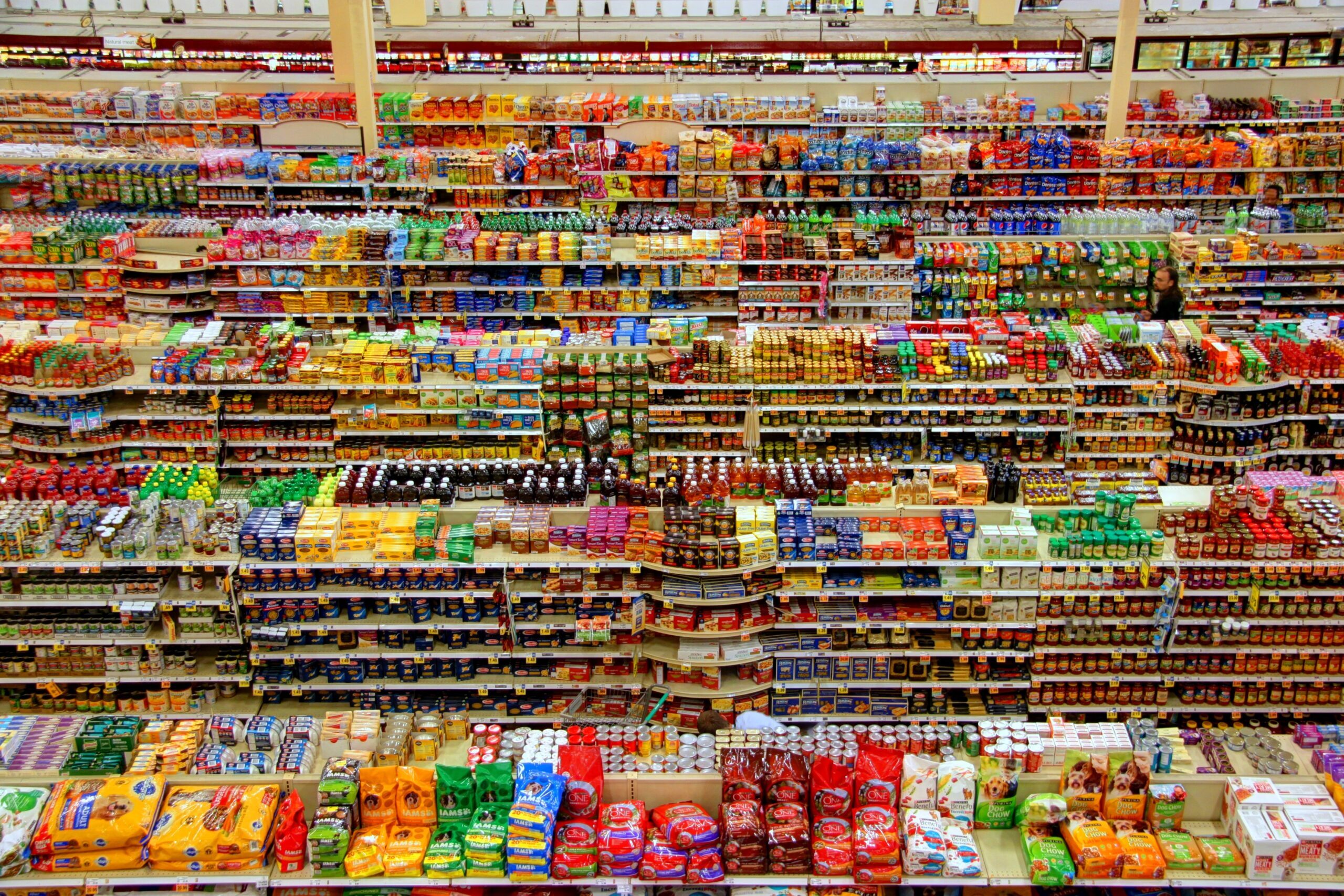 Aerial view of colourful products arranged on supermarket shelves