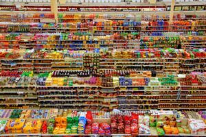 Aerial view of colourful products arranged on supermarket shelves