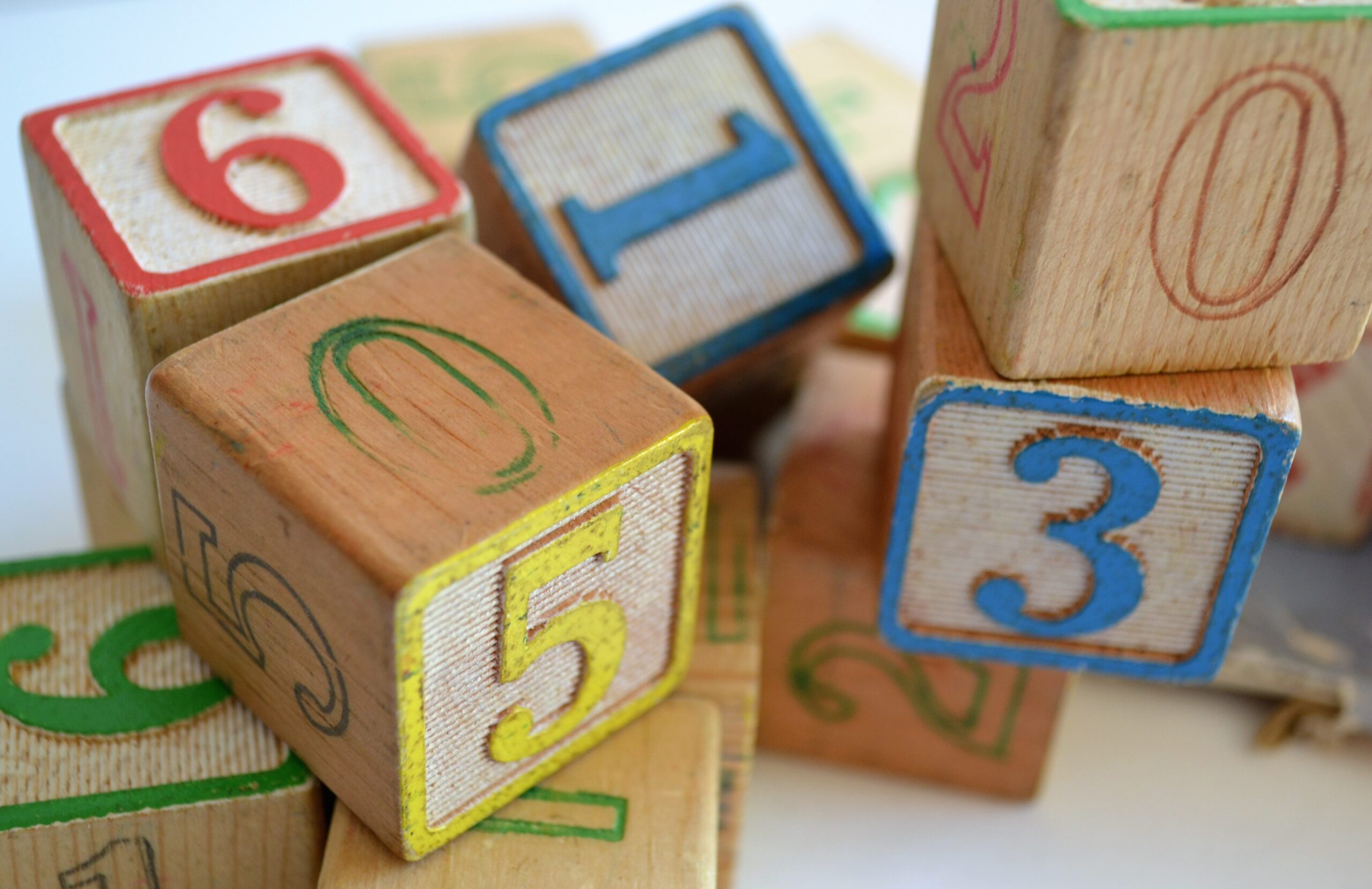 Colourful wooden blocks painted with letters and numbers