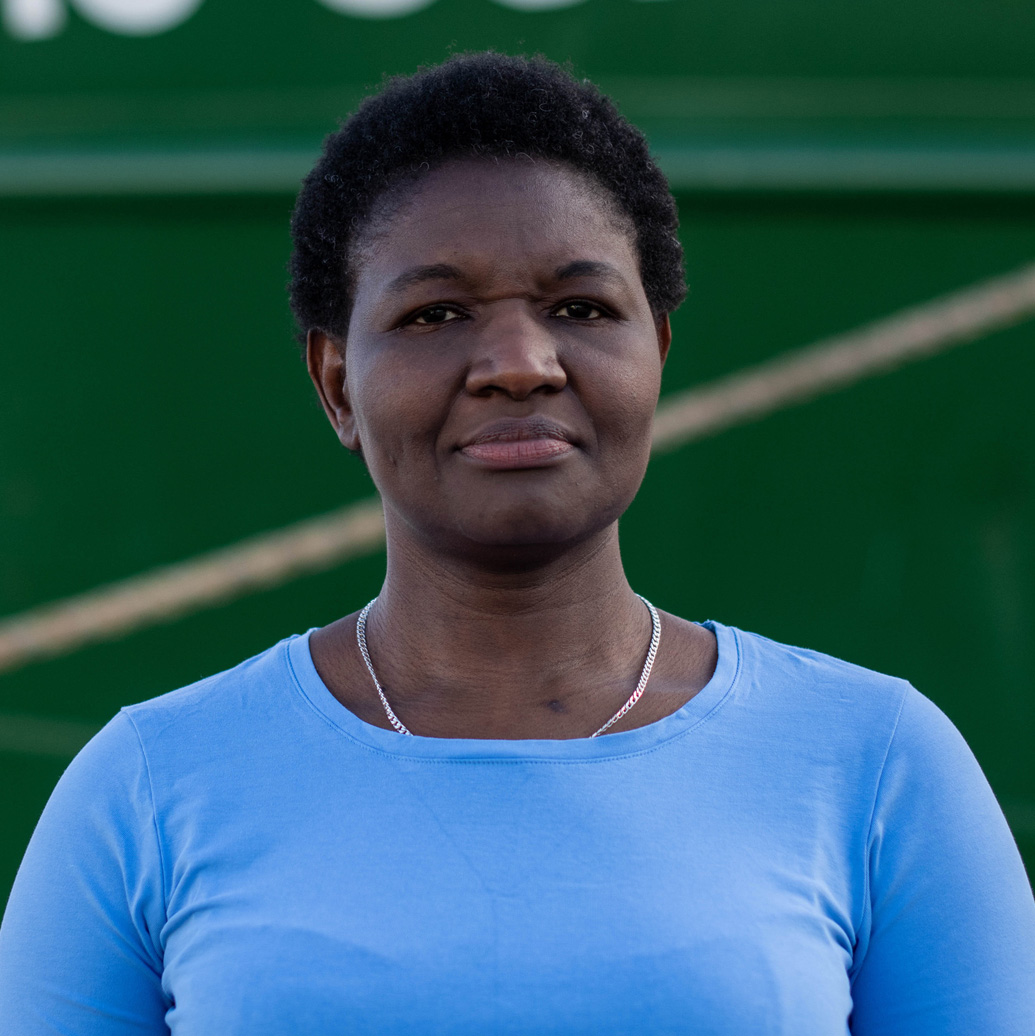 Victorine looks at the camera with a serious expression and slight smile.