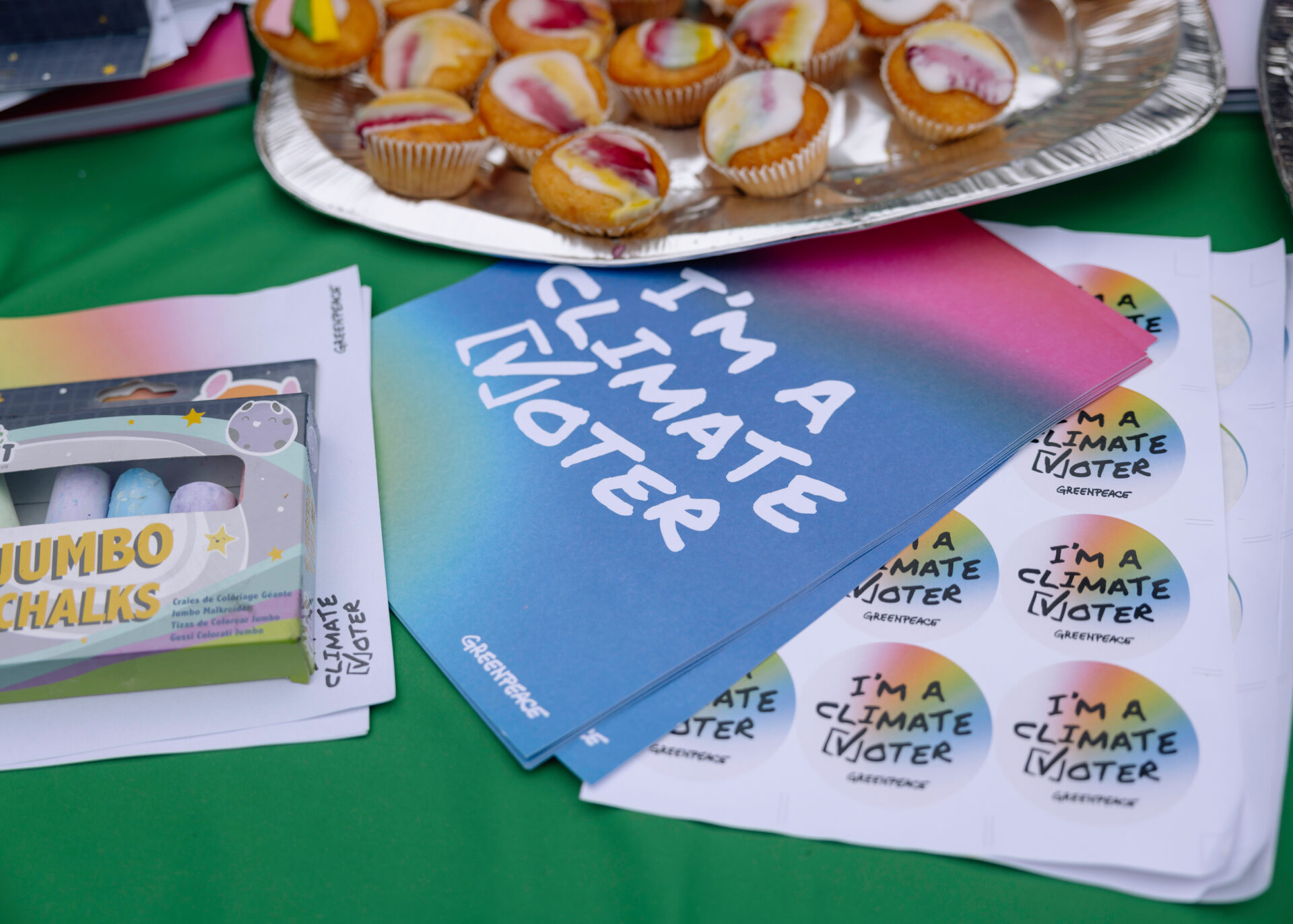 Climate voter stickers and posters arranged on a table