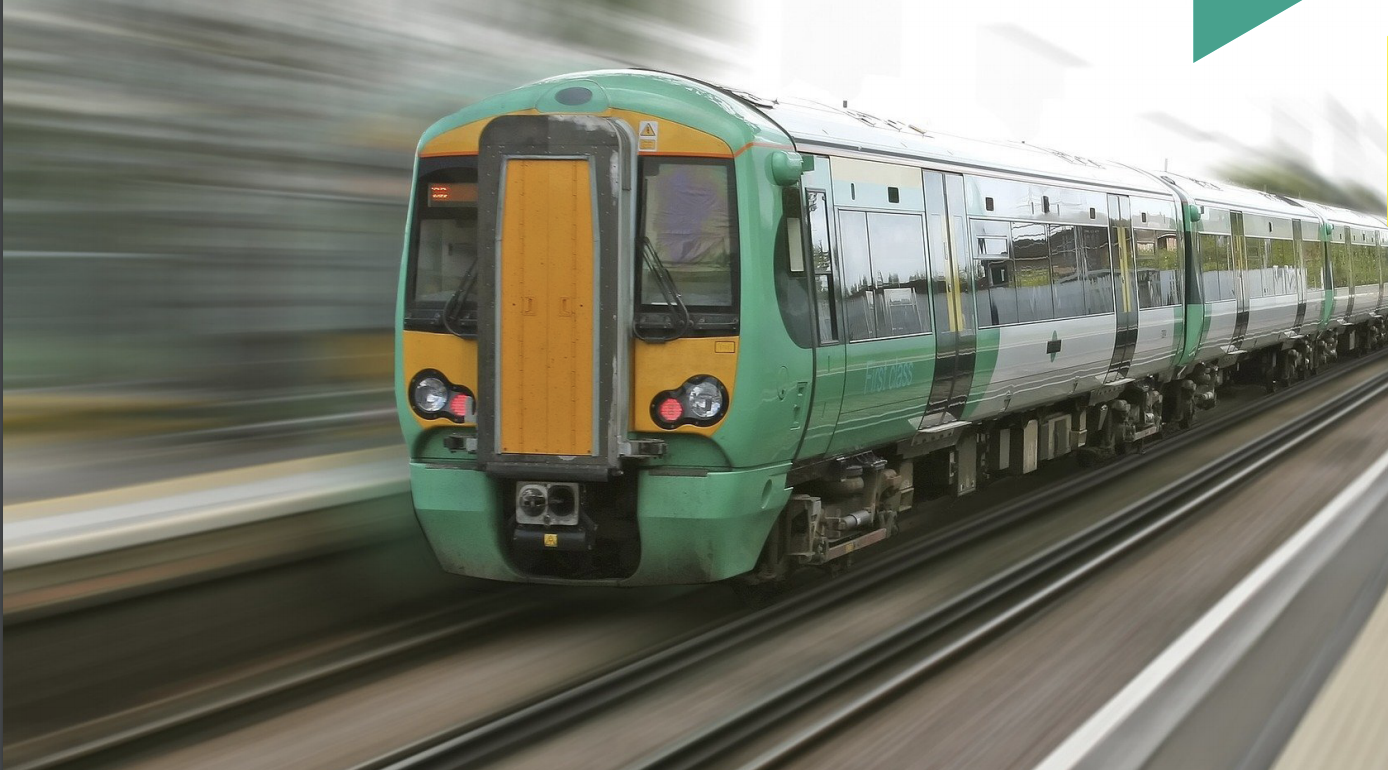 Train approaching the camera with motion-blurred background