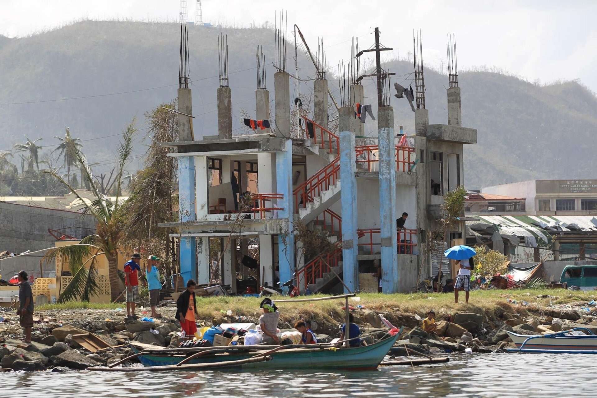 Destroyed House with boats in front
