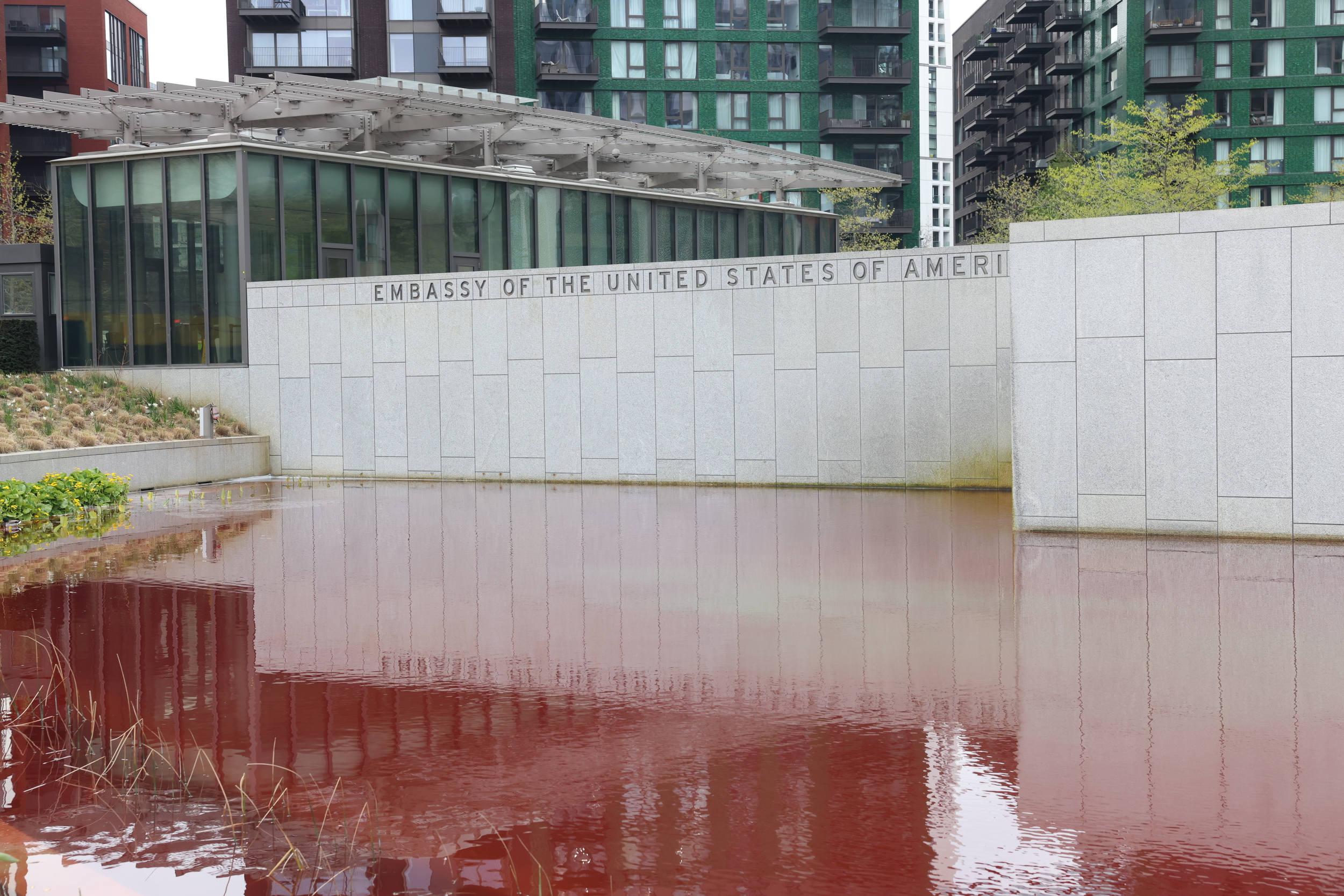 Blood-red dye stains an ornamental pond outside the US Embassy in London.