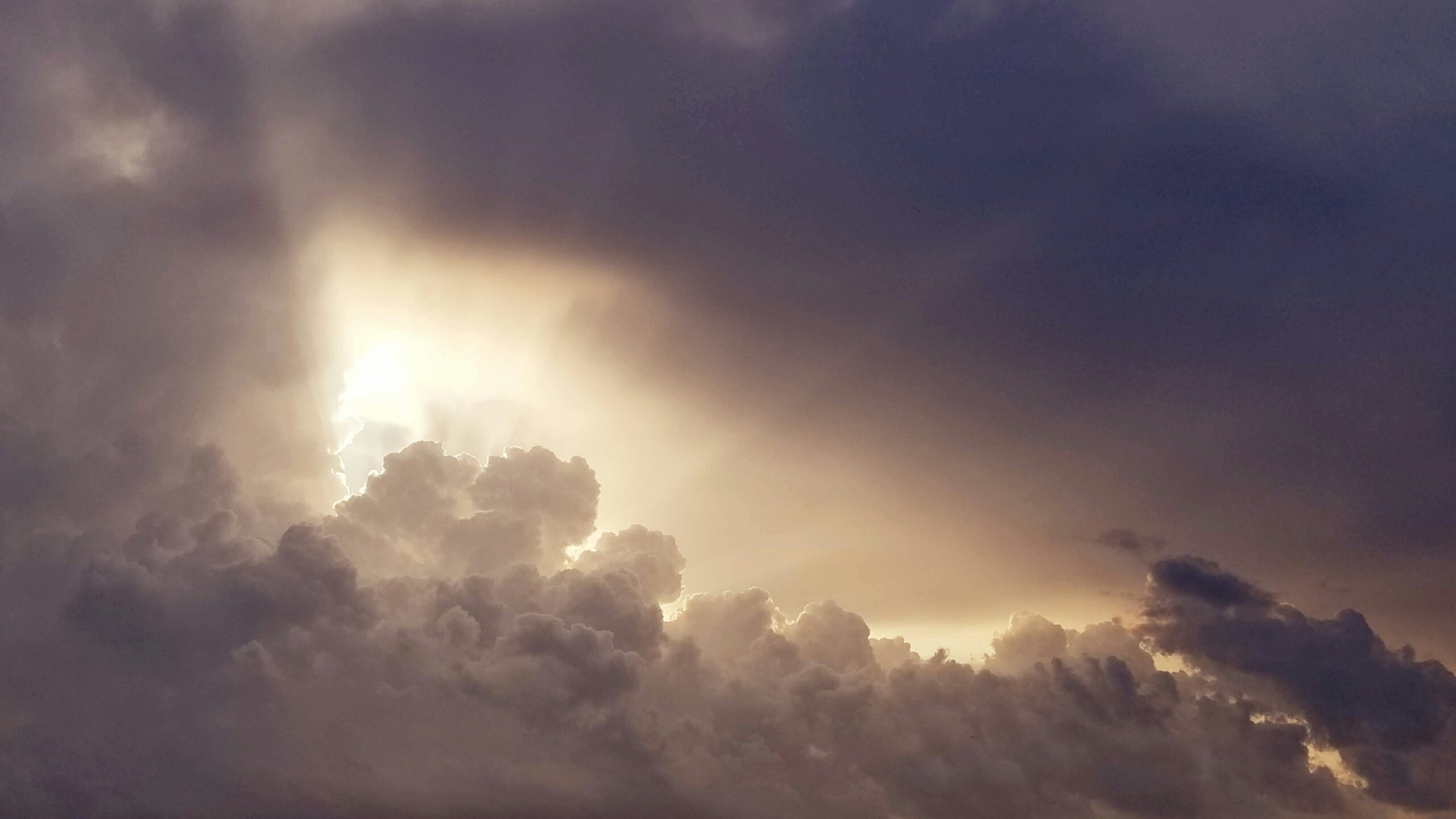 Sun shining through clouds