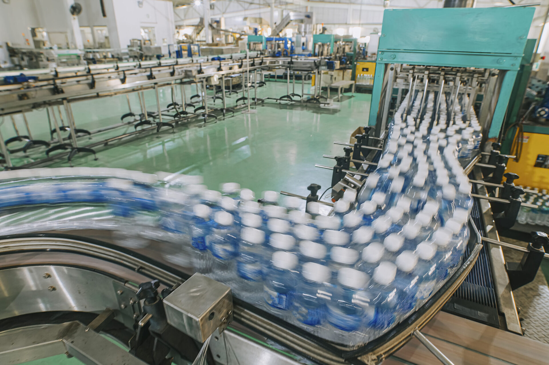 View of plastic bottles on a conveyor belt.