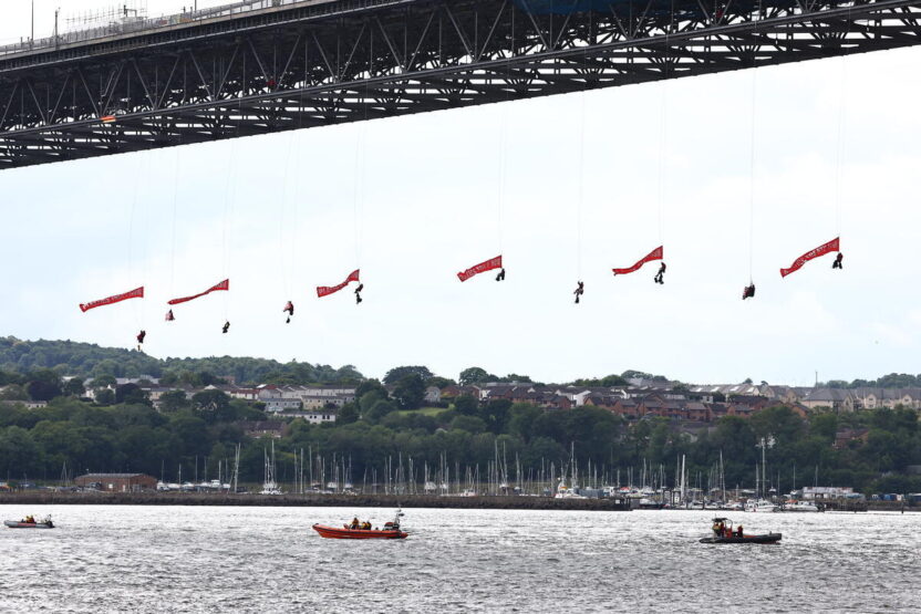 Greenpeace climbers abseil from Forth Bridge to block INEOS tanker in plastics protest
