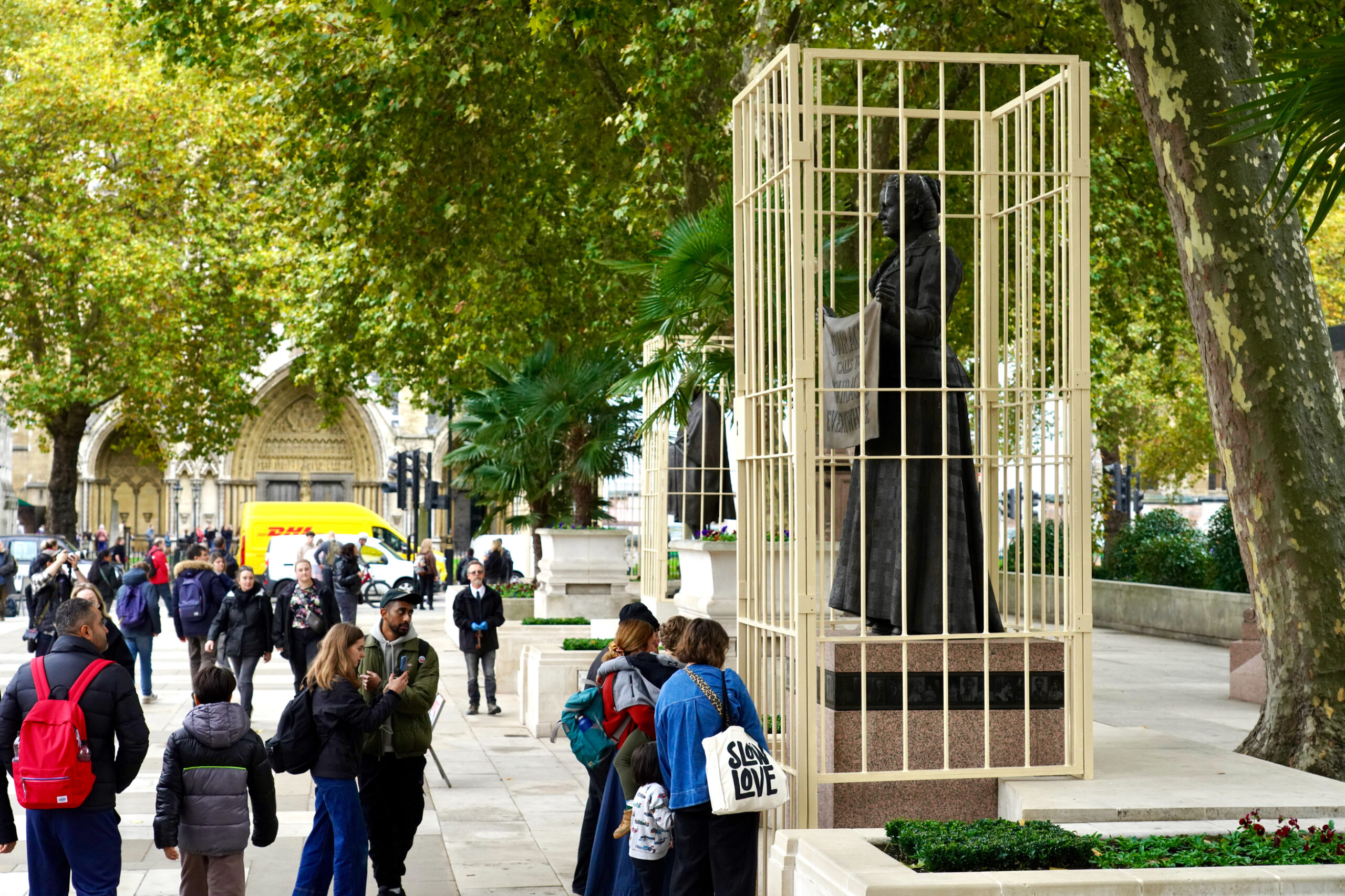 Why are there prison bars around the statues of Gandhi, Mandela and Fawcett in Parliament Square?